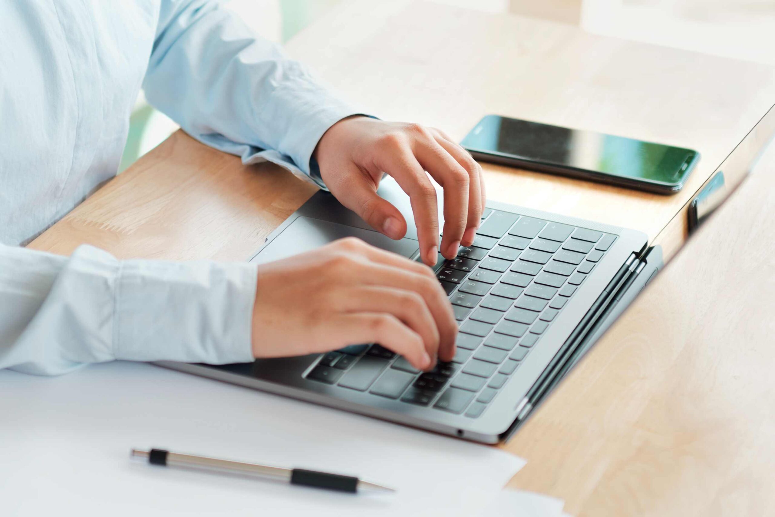 business-woman-typing-laptop-keyboard-working-desk-office